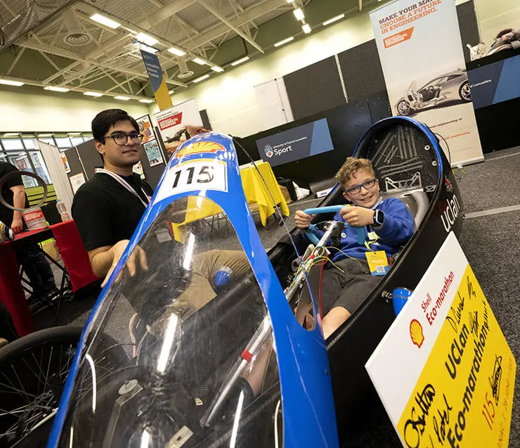 Harris Primary School pupil Harry Burnham, 11, sits in a UCLan race car