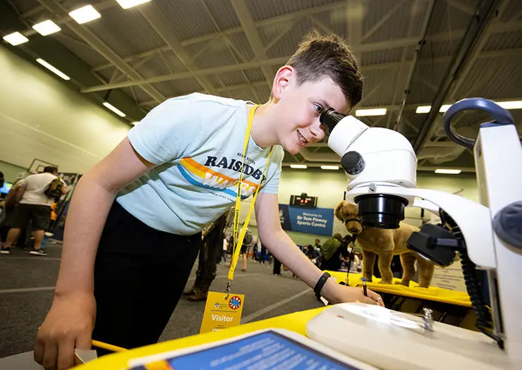 Jac Cardwell, 11, from Poulton looks at a tic under a microscope