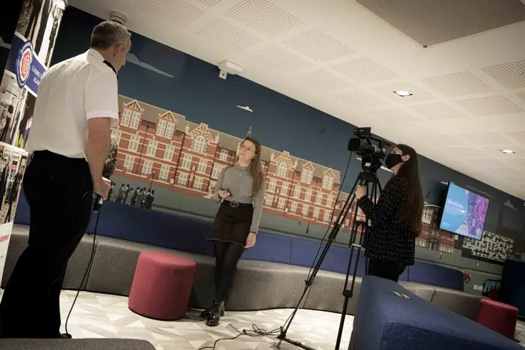 Alternative view of third year journalism student Maria Bright interviewing Chris Rowley, Chief Constable, Lancashire Constabulary