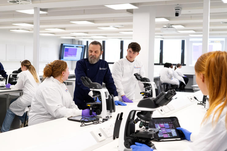 Students and staff in a laboratory