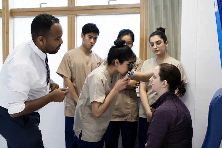 A patient volunteer having an eye exam