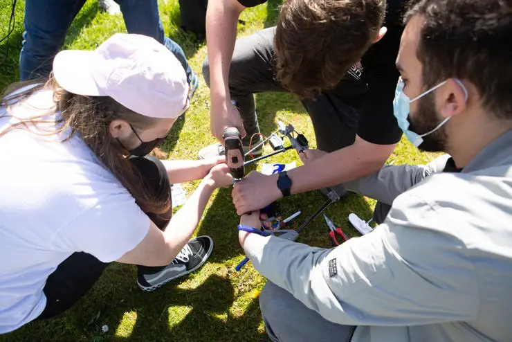Students making last minute tweaks to the glider before its maiden flight