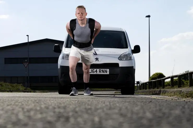 John pulling a van in training