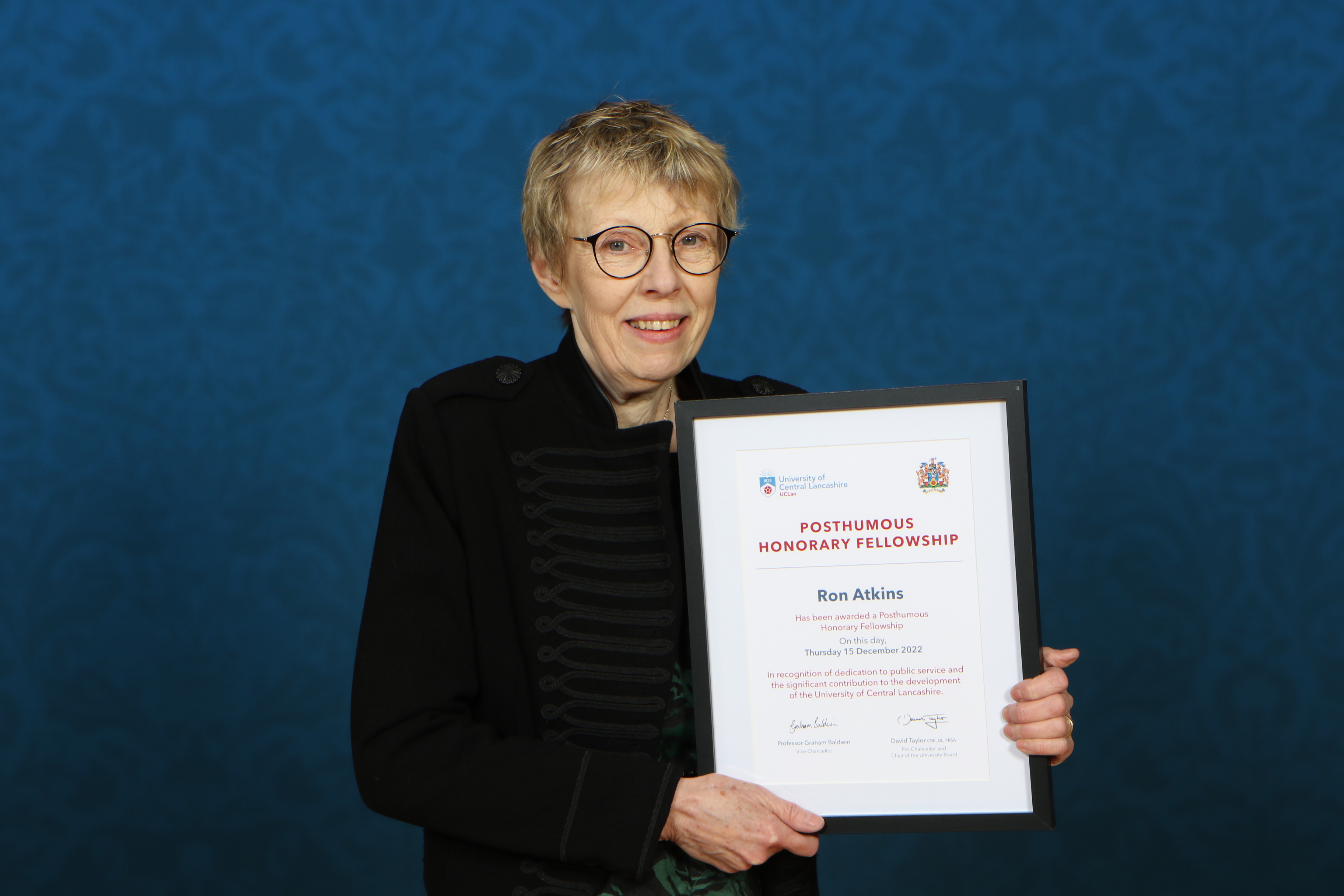news-liz atkins with her late husband Ron Atkins' posthumous Honorary Fellowship