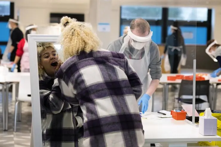 Nursing student Matthew Allott and acting student Ella Joseph-Stewart undertaking her Covid-19 test