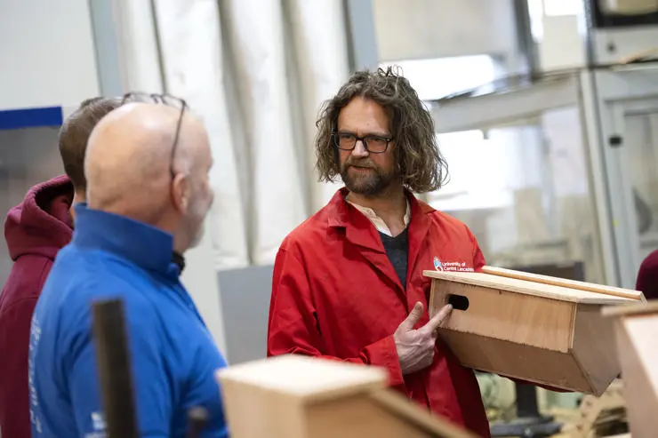 Jonathan Meadowcroft holding one of the swift boxes