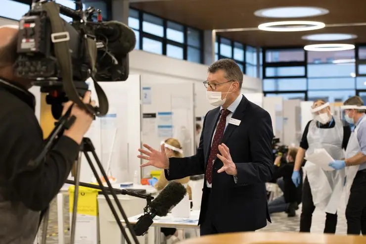 Vice-Chancellor Professor Graham Baldwin being interviewed in the Covid-19 testing centre by BBC North West Tonight