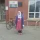 ruqiya standing in front ot building